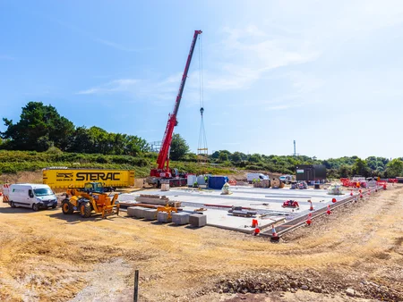 Shot of BESS 1 Battery storage plant construction with crane alternative angle.