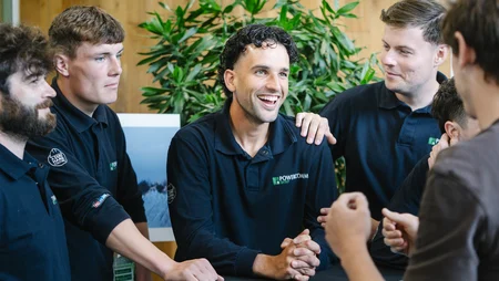 Laughing happy team, at event in new office