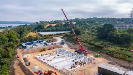 Overlooking of construction site of BESS 1 Battery storage plant with crane and civil works.
