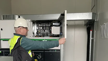 Martin Eager in substation in Bullstown Solar Farm