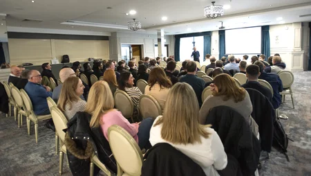 Back of head shot of team in conference room listening to speakers on safety day 2024.